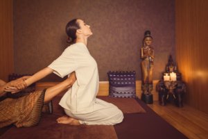 woman receiving a Thai massage