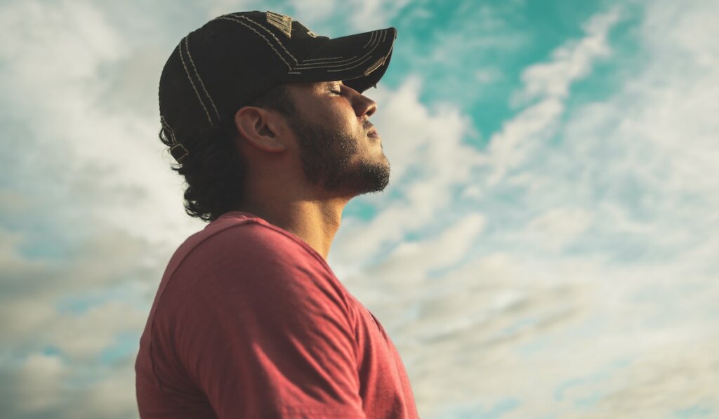 man meditating outdoors