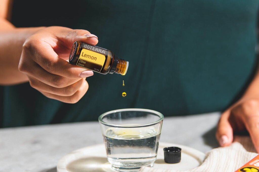 adding lemon essential oil to water