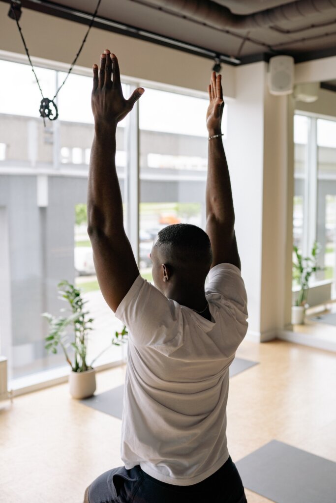 yoga pose with fitness trainer