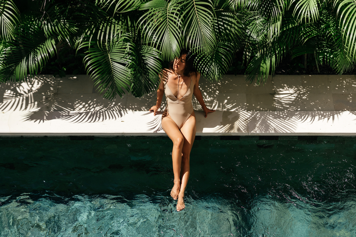 young woman relaxing at spa pool